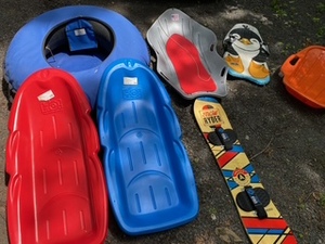 lot 240 image: Winter Fun - Sleds Inner Tube and Snowboard