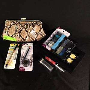 lot 24 image: Lot of Makeup Items with Snakeskin Clutch