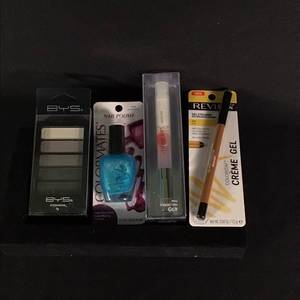 lot 31 image: Assorted Cosmetics Set with Eyeliner, Nail Polish, Eyeshadow, and Fragrance Mist