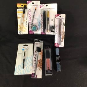 lot 32 image: Set of 8 Makeup Items Including Eyeliners, Gel, and Lip Color