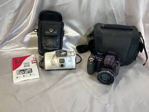 lot 58 image: FujiFilm FinePix S Camera and Canon Sure Shot with Cases
