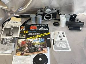 lot 59 image: Minolta XG-1 SLR Film Camera with Accessories and Manuals