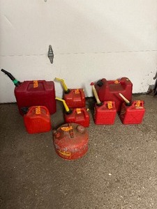 lot 127 image: 11 empty gas cans of various sizes
