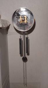 lot 55A image: Mid-Century George Nelson for Howard Miller pendulum wall clock with transparent face.