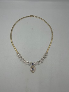 lot 270 image: .925 silver  gold necklace with blue stone pendant and rhinestones, 17  long marked LR