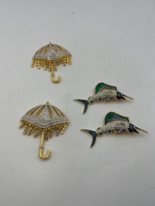lot 281 image: 4 BOLD Elegance brooches 2 Swordfish 2  l x 1 t 2 pave rhinestone umbrella brooches 2  t