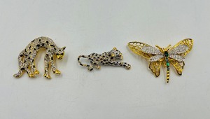 lot 282 image: Vintage brooches 2 Leopard gold-tone black enamelpave rhinestones w green eyes, 1 dragon fly or butterfly