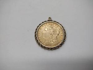 lot 241 image: Possibly rare gold colored 1879 Morgan silver dollar