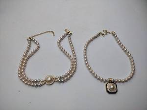 lot 275 image: 2 pearl necklaces. 17 and 20 1 is marked Bold Elegance