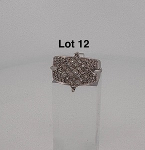 lot 12 image: 14KT white gold and diamond ring 9 grams
