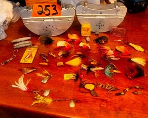 lot 253 image: Antique Fly lures, some Heddon we think 2 aluminum metal belt bait holders