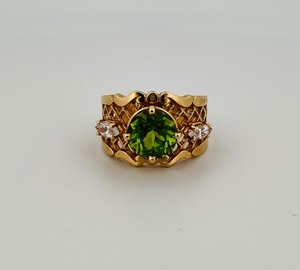 lot 36 image: 14K gold ring peridot (possibly) and CZ stones, Size 7  weighs 7g