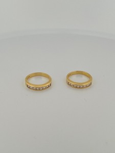 lot 72 image: Two 14k gold band with stones rings, both are size 7 6 grams total weight.