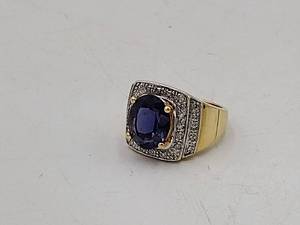 lot 33A image: 18k diamond ring with purple center stone. 10g size 7