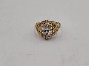 lot 70 image: 10k filigree gold ring with clear stone marquise shape.