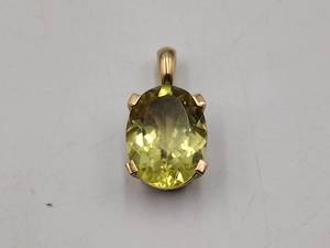 lot 71 image: 10k gold pendant with large yellow center stone. Marked LR