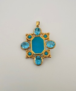 lot 27E image: 14K585 Tagliamonte Necklace pendant with a bas relief cupid carved in a aqua blue stone