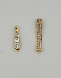lot 30D image: Two 14K pendants weigh 6g together. Vertical bar with CZ stones is 1  L Three-stone Drop is 1  L