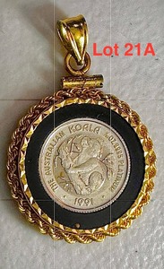 lot 21A image: 1991 Australian Koala 120 oz Platinum coin .9995 Platinum Coin in a 14K Gold rope bezel pendant.