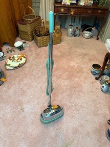 lot 313 image: Vintage General Electric chrome floor buffer with pads