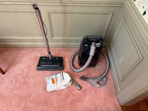 lot 314 image: Kenmore vacuum canister with power-mate attachment, as well as other assorted attachments
