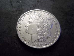 lot 7 image: 1885 O Morgan Silver Dollar