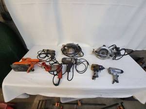 lot 15 image: Collection of Various Black & Decker Power Tools including Sander, Drill, and Saw