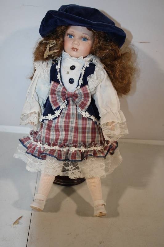 lot 81 image: Porcelain Doll with Plaid Dress and Blue Velvet Hat - 17 Inches
