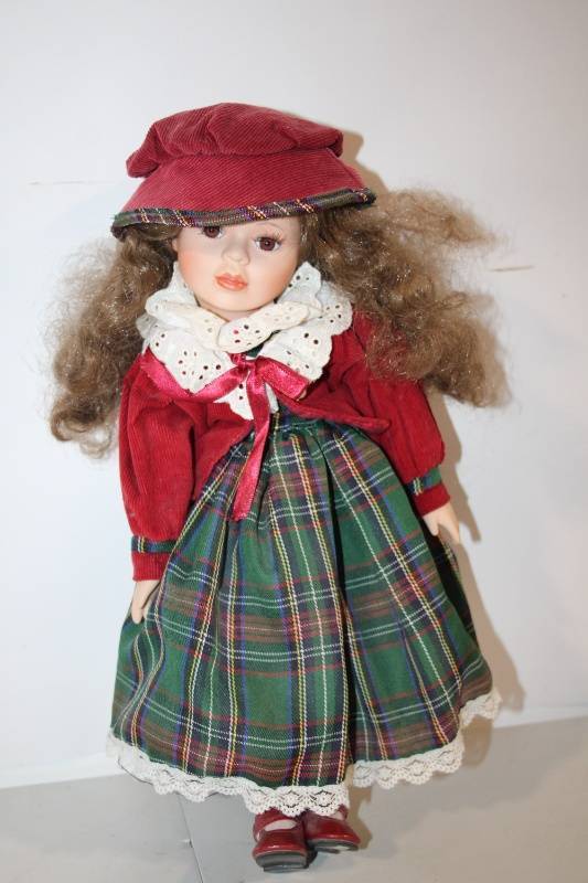 lot 86 image: Porcelain Doll in Red and Green Plaid Dress with Hat
