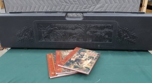 lot 9 image: KOLPIN HARD SIDED GUN CASE AND BOOKS