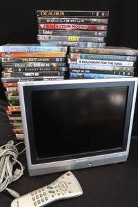 lot 39 image: DVD PLAYER  OVER 50 DVDS.