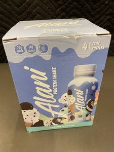 lot 65 image: Alani Protein Shake Cookies & Cream - 4 Pack of 12oz Bottles