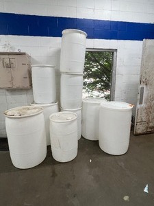 lot 18 image: 9 Drums. Four 55 Gallon Drums, Five 30 Gallon Drums,