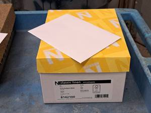 lot 99 image: Lot of (1 Box) A7 Envelopes  70#  Avon Brilliant White  Linen 5-14x7-14 - Neenah Classic Linen 250-count ( 250 total items )