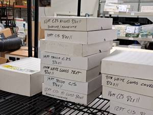 lot 231 image: Lot of (1 Shelf  12 Items) Assorted Paper Stock - 80# White Gloss Cover, 16pt C2S, 12pt C1S, 80# White Gloss Cover, 100# Gloss Cover, 12pt C1S Hi-Gloss BindacoteKromecote, 14pt Tango C1S, 14pt Tango C2S, 12pt C2S Tango and more 8-12x11