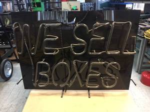 lot 223 image: We Sell Boxes Light-Up Neon Sign 32 x 24