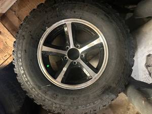 lot 26 image: TRAILER TIRE AND RIM