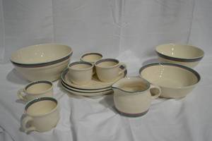 lot 53 image: Pfaltzgraff Juniper teal and mauve stoneware.