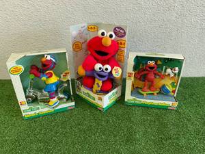 lot 249 image: Elmos Scooter, Jump & Learn Elmo & Playtime Talker Elmo