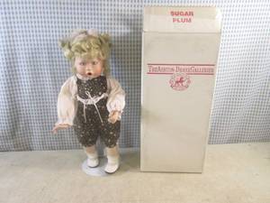 lot 37 image: (EC1) 14 Porcelain Doll with Stand...