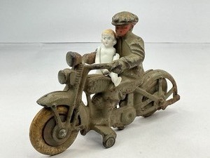 lot 1 image: Hubley Cast Iron Harley Davidson Motorcycle with Antique Bisque Passenger