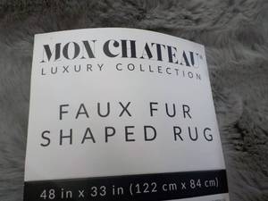 lot 27 image: Mon Chateau Faux Fur Shaped Rug 48 ...