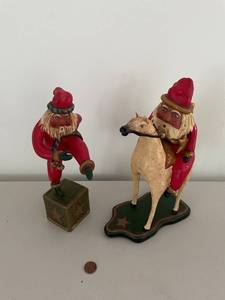 lot 21 image: Set of 2 Jauquet Santa Figurines - Santa on Horse & Santa on Cube