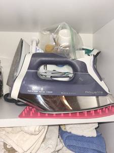 lot 101 image: Rowenta Steam Iron and Adjustable Ironing Board Set