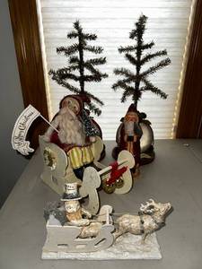 lot 156 image: Festive Christmas Decor Set with Santas, Sleighs, and Trees