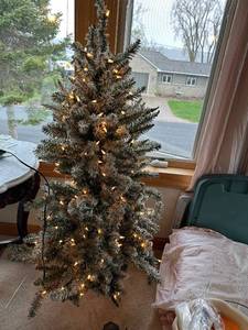 lot 232 image: 6 Foot Flocked Christmas Tree with Lights and Cherub Decorations