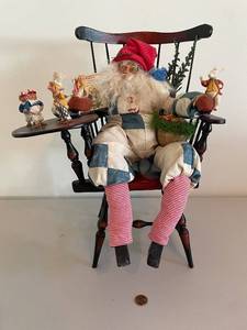 lot 313 image: Alice in Wonderland Themed Santa Doll on Rocking Chair