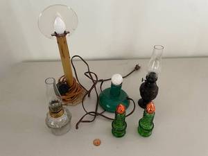 lot 751 image: Collection of Vintage Oil Lamps and Green Glass Candle Holders