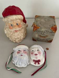 lot 753 image: Santa and Mrs. Claus Ceramic Masks with Santa Cookie Jar and St. Nicholas Box