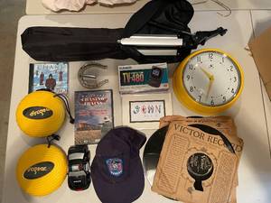 lot 867 image: Mixed Lot with Yellow Wall Clock, Police Cap, and Toy Car